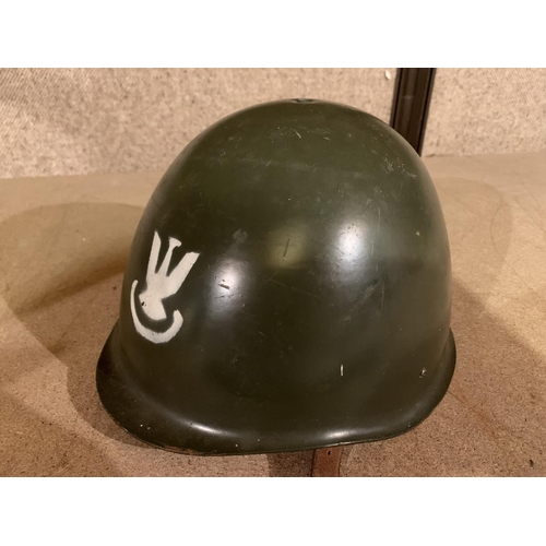 600 - A POLISH MILITARY HELMET AND TWO AIRCRAFT BOOKS