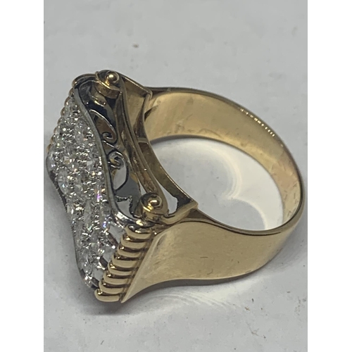 601 - A HEAVY 18 CARAT GOLD RING WITH FIFTEEN DIAMONDS SET IN A RECTANGLE OF DIAMOND CHIPS GROSS WEIGHT 13... 