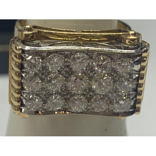 601 - A HEAVY 18 CARAT GOLD RING WITH FIFTEEN DIAMONDS SET IN A RECTANGLE OF DIAMOND CHIPS GROSS WEIGHT 13... 