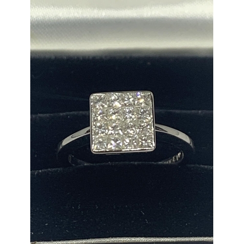 602 - AN 18 CARAT WHITE GOLD RING WITH SIXTEEN DIAMONDS SET IN A SQUARE GROSS WIEGHT 3.9 GRAMS SIZE L/M WI... 