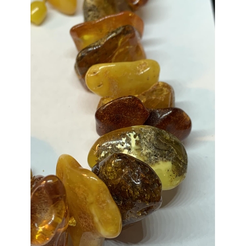 607 - A BUTTERSCOTCH AMBER NECKLACE GROSS WEIGHT 149 GRAMS LENGTH 56CM