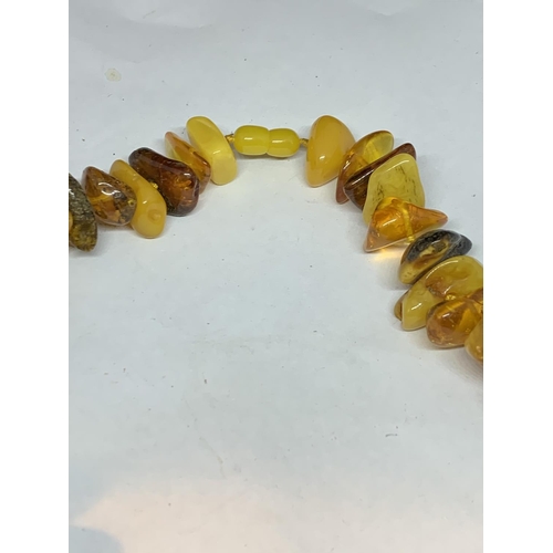 607 - A BUTTERSCOTCH AMBER NECKLACE GROSS WEIGHT 149 GRAMS LENGTH 56CM