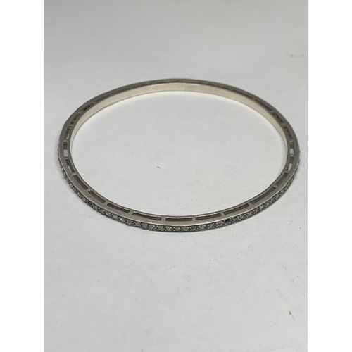 670 - A SILVER BANGLE WITH DIAMOND CHIPS (SOME MISSING)