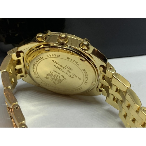 AN ASTON GERARD GOLD PLATED WATCH WITH DIAMONDS IN A PRESENTATION BOX