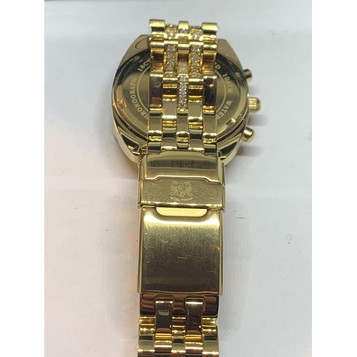 671 - AN ASTON GERARD GOLD PLATED WATCH WITH DIAMONDS IN A PRESENTATION BOX