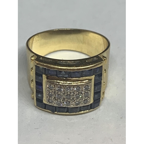 677 - AN 18 CARAT GOLD RECTANGULAR DIAMOND CLUSTER RING WITH A CUSHION CUT SAPPHIRE BORDER