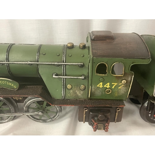 303 - A TIN PLATE MODEL OF THE FLYING SCOTSMAN LOCOMOTIVE AND TENDER