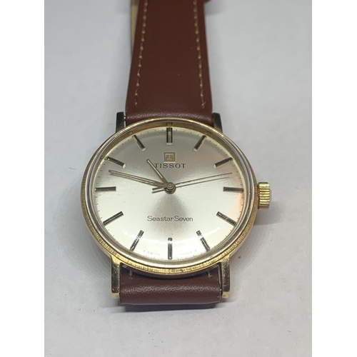 556 - A 9 CARAT GOLD TISSOT SEASTAR SEVEN WRIST WATCH (ENGRAVED ON BACK TO 1969) WITH PRESENTATION CASE