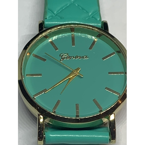 558 - A TURQUOISE GENEIVE WRIST WATCH SEEN WORKING NO WARRANTY