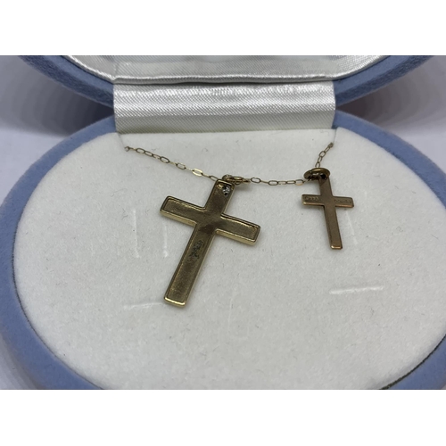 563 - A 9 CARAT GOLD CHAIN WITH TWO 9 CARAT GOLD CROSS PENDANTS ONE WITH CLEAR STONE CHIP DESIGN IN A PRES... 