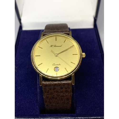 579 - AN AS NEW AND BOXED H SAMUEL WRIST WATCH WITH LEATHER STRAP SEEN WORKING BUT NO WARRANTY