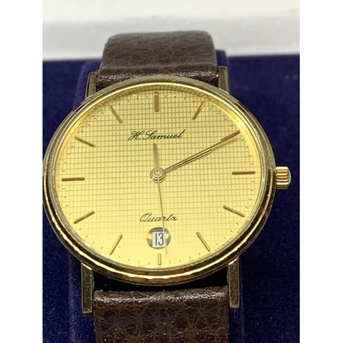 579 - AN AS NEW AND BOXED H SAMUEL WRIST WATCH WITH LEATHER STRAP SEEN WORKING BUT NO WARRANTY