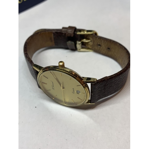 579 - AN AS NEW AND BOXED H SAMUEL WRIST WATCH WITH LEATHER STRAP SEEN WORKING BUT NO WARRANTY