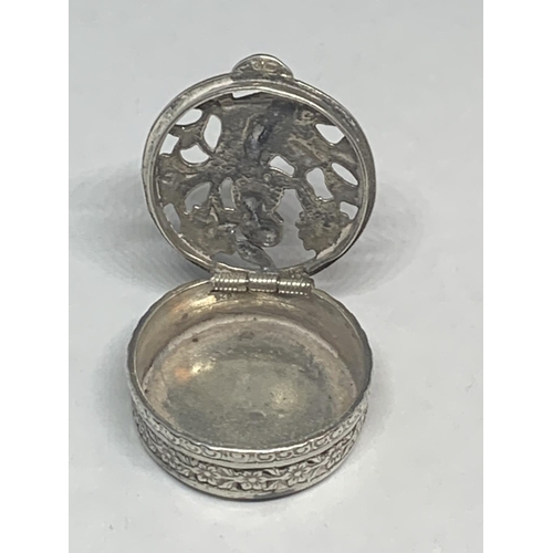 544 - AN ORNATE SILVER PILL BOX