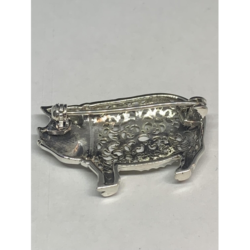 591 - AN ORNATE MARKED SILVER PIG BROOCH