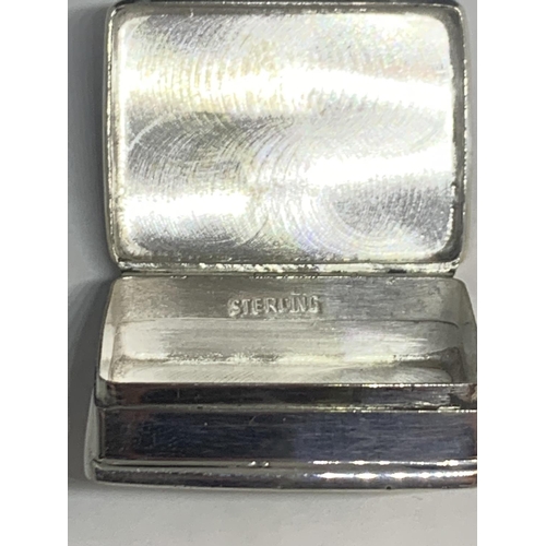 600 - A MARKED SILVER PILL BOX WITH AN ENAMEL EROTIC DESIGN TOP