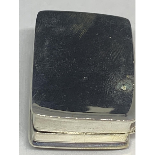 600 - A MARKED SILVER PILL BOX WITH AN ENAMEL EROTIC DESIGN TOP