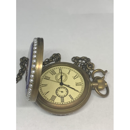 603 - A DEOCRATIVE LADIES POCKET WATCH WITH CHAIN