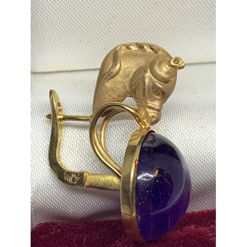 531 - A PAIR OF 12 CARAT YELLOW GOLD HORSES HEAD  DESIGN EARRINGS WITH CABOUCHON AMETHYST  DECORATION BY L... 