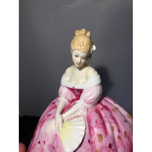 710 - A ROYAL DOULTON FIGURINE 'VICTORIA'