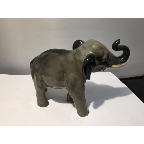 719 - A ROYAL DOULTON FIGURINE OF A GREY ELEPHANT