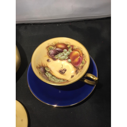 735 - TWO GILDED AYNSLEY FRUIT DECORATED ITEMS TO INCLUDE A CUP AND SAUCER AND A LIDDED JAR