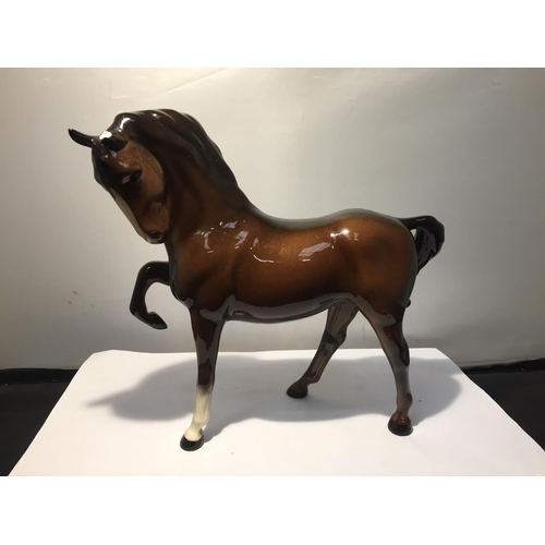 739 - TWO BESWICK BAY HORSES TO INCLUDE A  PRANCING SHIRE AND A THOROUGHBRED (EAR A/F)