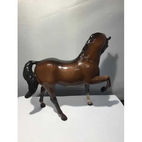 739 - TWO BESWICK BAY HORSES TO INCLUDE A  PRANCING SHIRE AND A THOROUGHBRED (EAR A/F)