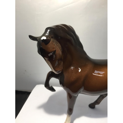 739 - TWO BESWICK BAY HORSES TO INCLUDE A  PRANCING SHIRE AND A THOROUGHBRED (EAR A/F)