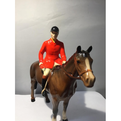 752 - A BESWICK HUNTSMAN ON A BAY HORSE