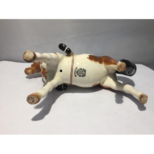 759 - A BESWICK SKEWBALD PONY WITH GIRL RIDER