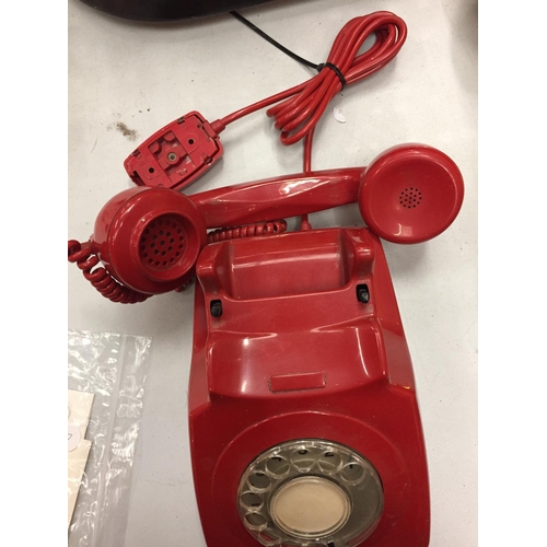 144 - A RETRO RED DIAL UP TELEPHONE IN RED