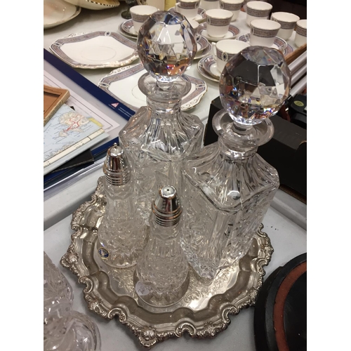 147 - A MIXED COLLECTION OF GLASSWARE TO INCLUDE TWO DECANTERS A CRUET SET AND SUGAR SHAKER