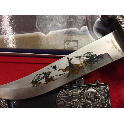 148 - A BOXED ORNATE KNIFE IN AN ELEPHANT DESIGN