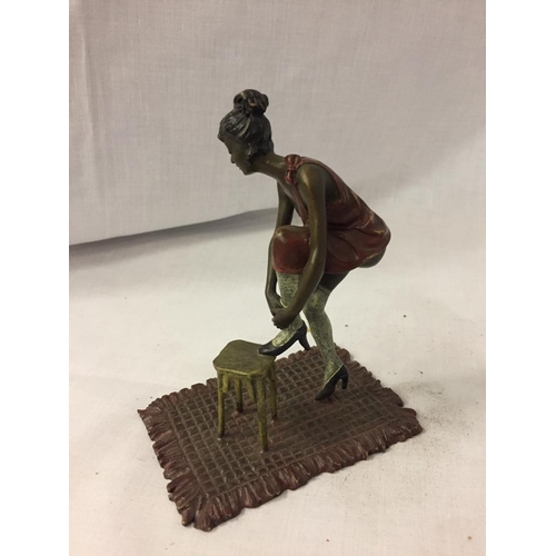 208 - A BERGMAN STYLE COLD PAINTED FIGURINE OF A LADY WITH HER FOOT ON A STOOL HEIGHT APPROXIMATELY 12CM H... 