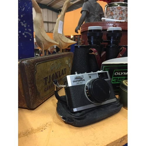 273 - AN OLYMPUS 35RC CAMERA, A PAIR OF BINOCCULARS AND A VINTAGE TIN