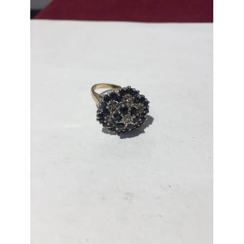 615 - A 9CT GOLD RING WITH THIRTY SAPHIRES AND SEVEN DIAMONDS. SIZE N/O - 5.7GMS