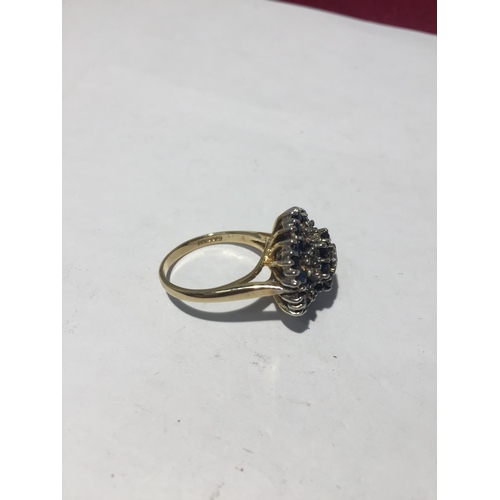 615 - A 9CT GOLD RING WITH THIRTY SAPHIRES AND SEVEN DIAMONDS. SIZE N/O - 5.7GMS