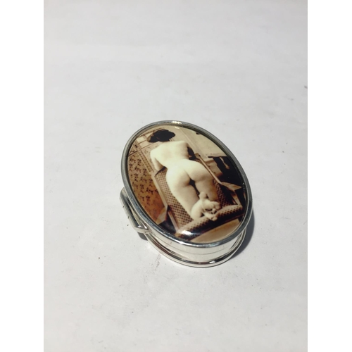 617 - A MARKED 925 SILVER PILL BOX WITH AN ENAMEL  EROTIC DESIGN TOP