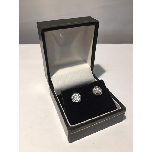 632 - A PAIR OF 18 CARAT WHITE GOLD AND DIAMOND EARRINGS IN A PRESENTATION BOX