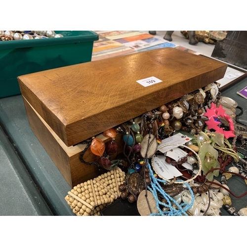 109 - A WOODEN BOX CONTAINING A LARGE QUANTITY OF COSTUME JEWELLERY