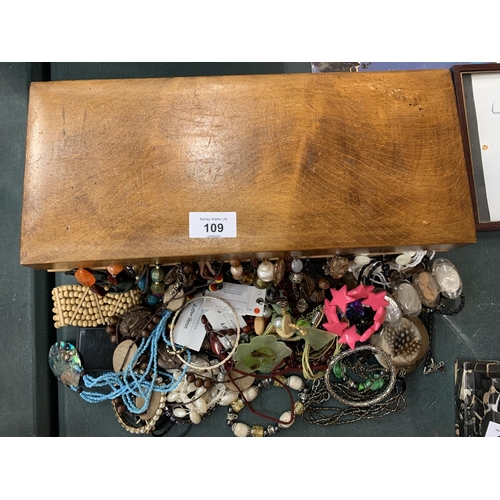 109 - A WOODEN BOX CONTAINING A LARGE QUANTITY OF COSTUME JEWELLERY