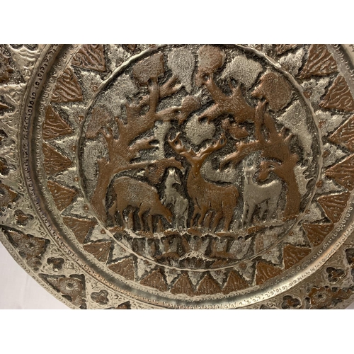 163 - A LARGE MIDDLE EASTERN / ORIENTAL WHITE METAL CHARGER WITH FIGUAL DESIGN