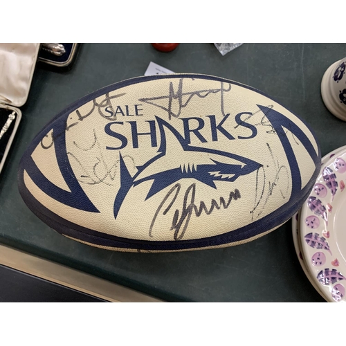 164 - A FRAMED AND SIGNED SALE SHARKS SHIRT AND A SIGNED RUGBY BALL