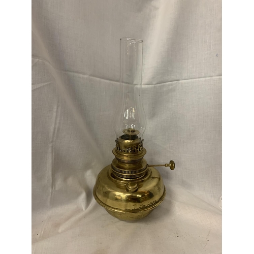 167 - A VINTAGE BRASS OIL LAMP TO INCLUDE A GLASS FUNNEL H: TO TOP OF WICK 23CM