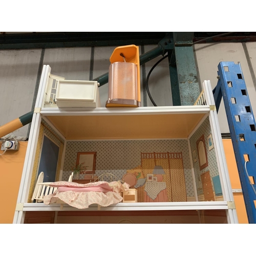 315A - A VERY LARGE THREE STOREY SINDY DOLLS HOUSE WITH ROOF TOP TERRACE TO INCLUDE SINDY FURNITURE