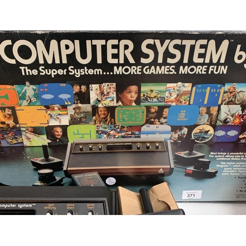 371 - A BOXED VIDEO COMPUTER SYSTEM BY ATARI,  MODEL NUMBER CX-2600