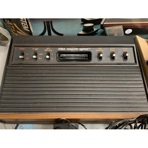 371 - A BOXED VIDEO COMPUTER SYSTEM BY ATARI,  MODEL NUMBER CX-2600