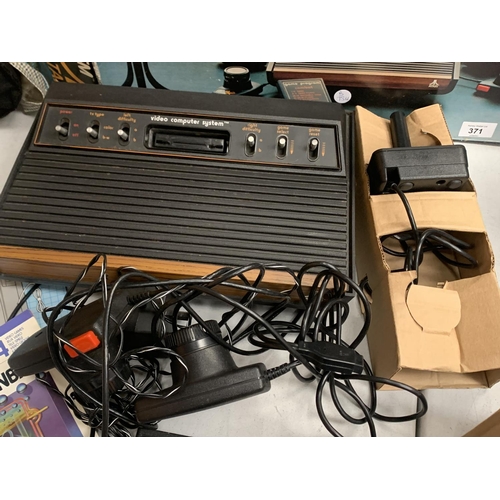 371 - A BOXED VIDEO COMPUTER SYSTEM BY ATARI,  MODEL NUMBER CX-2600