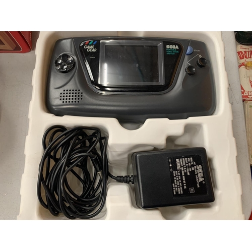 394 - A BOXED PORTABLE HAND HELD SEGA GAME + GEAR (INCLUDES ADAPTER)